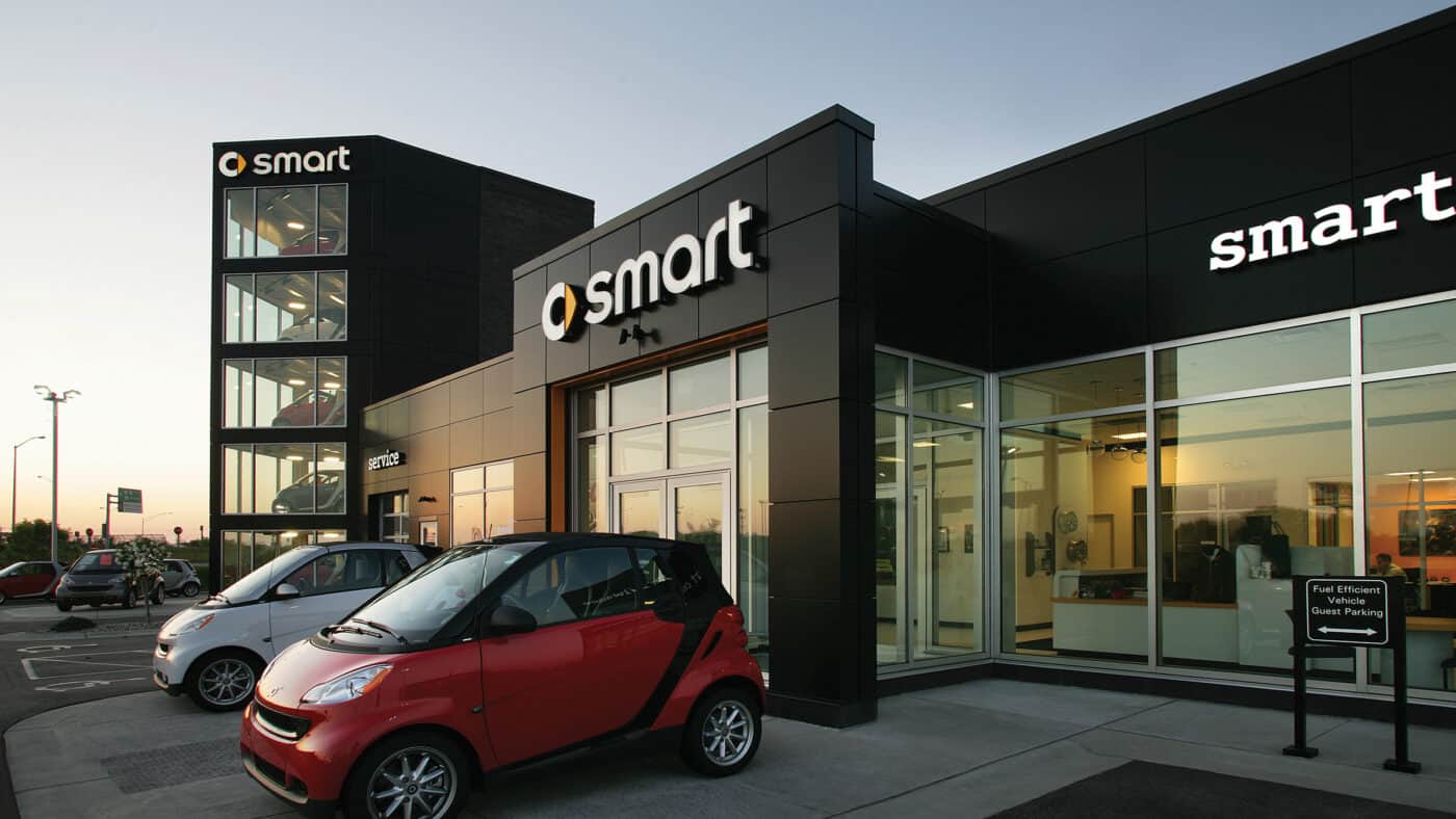 Bergstrom Automotive - Smart Car Dealership Exterior with 2 Smart Cars Parked Outside
