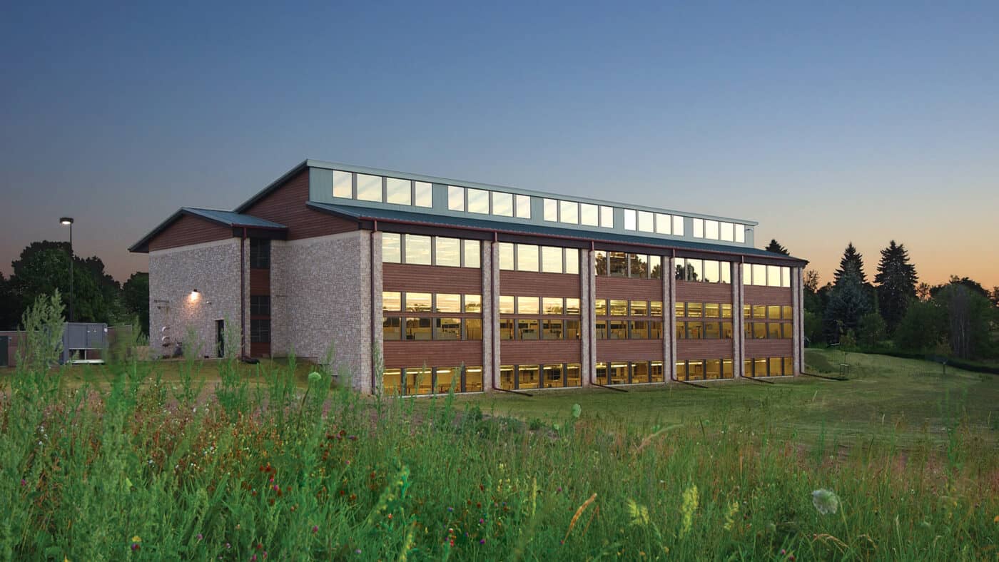 DNR Regional Headquarters and Service Center Exterior at Dusk from Prairie