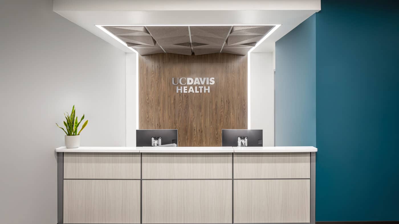 University of California - Davis - Health Clinic - Interior View of Reception Desk with UC-Davis Health Signage